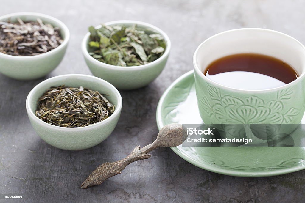 Different sorts of green tea Different sorts of green tea and teacup. Selective focus Blossom Stock Photo