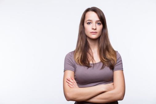Serious Young Woman With Arms Crossed