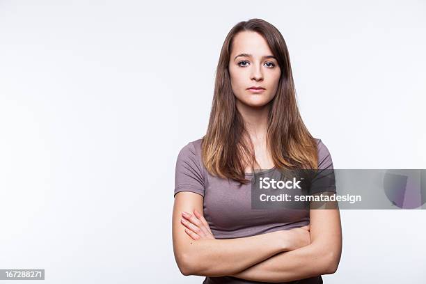 Serious Young Woman With Arms Crossed Stock Photo - Download Image Now - Women, One Woman Only, Serious