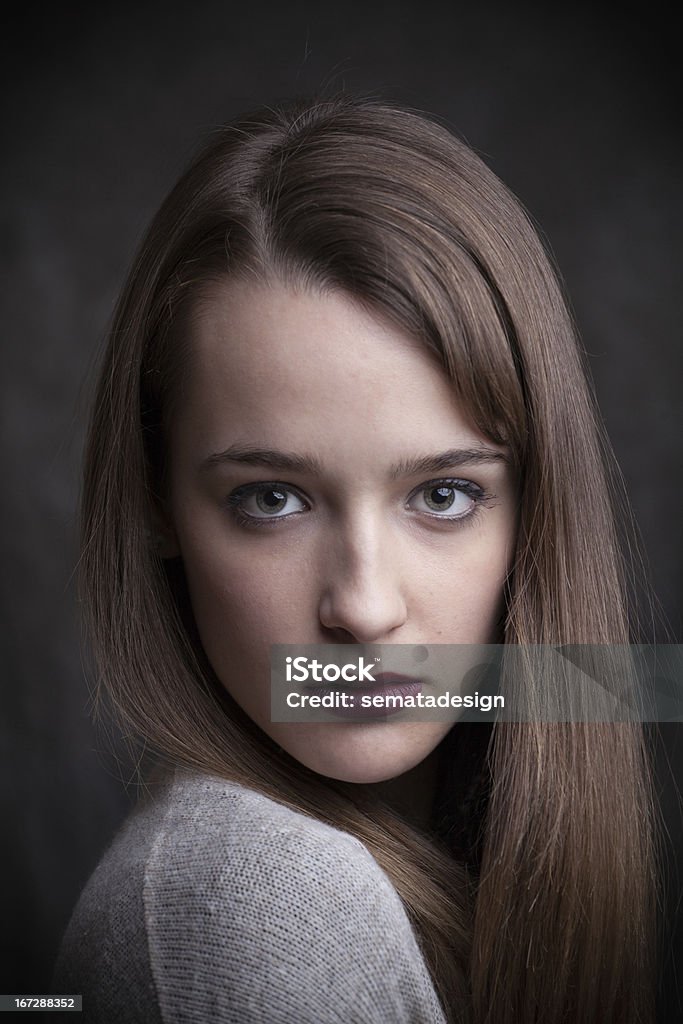 Beautiful young woman Studio shot of young beautiful woman on dark background. Adult Stock Photo
