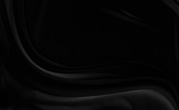 istock Black gray satin dark fabric texture luxurious shiny that is abstract silk cloth background with patterns soft waves blur beautiful. 1672897012