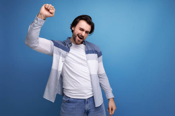 istock energetic smart brunette man rejoices at the decision 1672903470