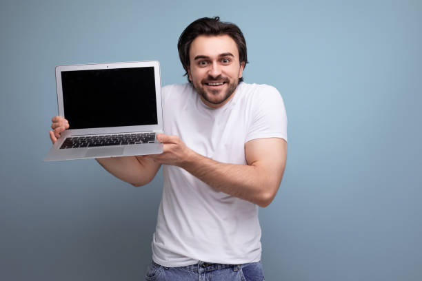 istock successful freelancer man with laptop in studio 1672904778