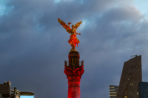 Independence monument illuminated with colors of the national flag during the month of September, for National Independence Day, shoot at sunset.