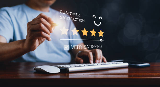istock Man Gives 5-Star Rating on Computer, Exuding Customer Satisfaction 1672932990