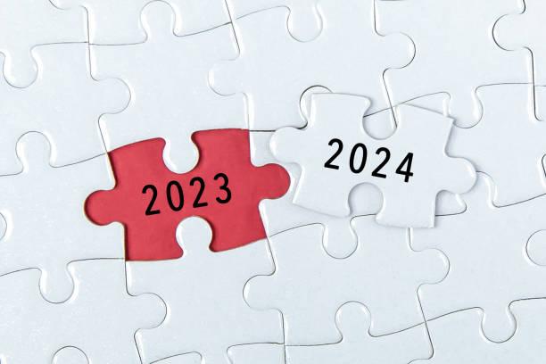 istock 2023, 2024 on puzzle background, business concept. 1672958703