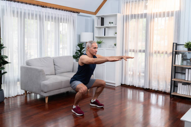 istock Active and fit senior man warmup and stretching before home exercising. Clout 1672984393