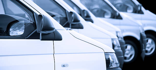 istock New white vans in a row on black 167298825