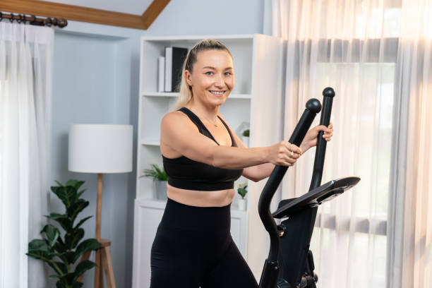 istock Active senior woman running on elliptical running machine. Clout 1673004686