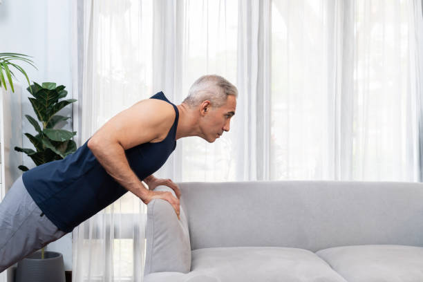 istock Athletic and active senior man using furniture for pushup. Clout 1673014068