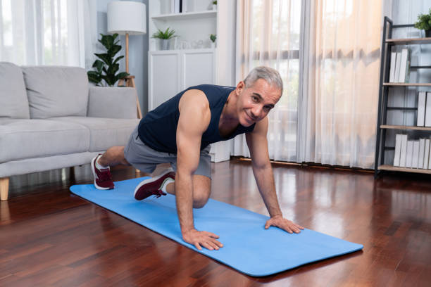 istock Athletic and active senior man doing plank climbing at home. Clout 1673015093