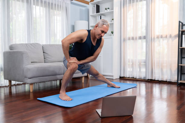 istock Active and fit senior man warmup and stretching before home exercising. Clout 1673029368