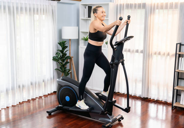 istock Active senior woman running on elliptical running machine. Clout 1673054122