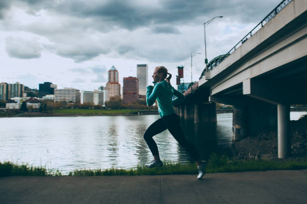 istock Female Runner Jogging in the City 167305432