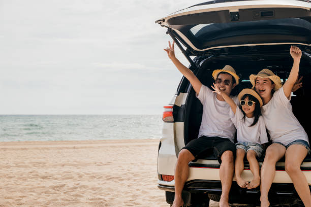 istock people having fun in summer vacation on beach with automobile 1673055774