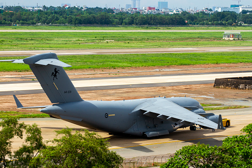 Ho Chi Minh City, Vietnam - May 1, 2022 : A Boeing C-17A Globemaster III Aircraft Of Royal Australian Air Force Moved To Taxiway By Pushback Tractor In Tan Son Nhat International