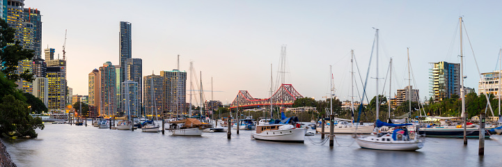 Wide angle panoramic view of Brisbane Rive with the city and story bridge are in view.
