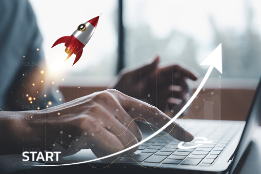 Connect your business to success with this digital rocket icon launching from a laptop into the future of technology and growth. Network connection on modern virtual interface.