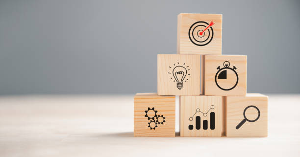 istock Wooden block cude step on table with Action Plan 1673084720