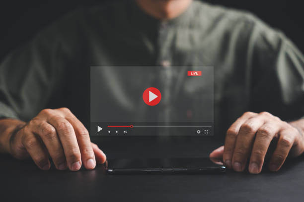 istock Man enjoying video streaming on virtual screen with a smartphone 1673084736