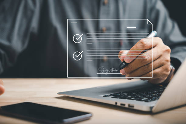 istock Efficient document management Businessman uses pen to sign electronic documents on virtual screen 1673084740
