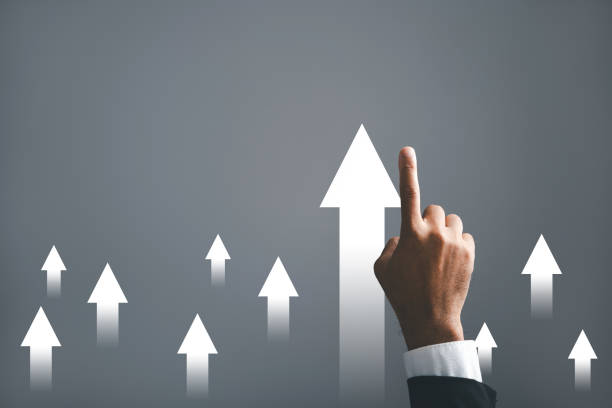 istock A businessman hand confidently guides an arrow on a graph 1673085279