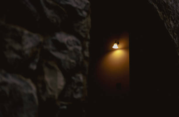 istock light from the lamp in the cave with a stone wall in the background 1673088224