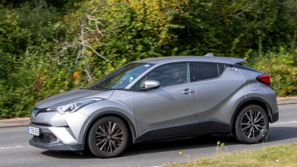 Toyota C HR Milton Keynes,UK-Sept 10th 2023: 2017 silver Toyota C HR Excel hybrid electric car travelling on an English road. saloon car stock pictures, royalty-free photos & images