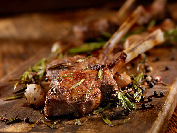 Braised Lamb Chops Rack of Lamb with Garlic, Rosemary and Peppercorns - Photographed on Hasselblad H3D2-39mb Camera meat chop stock pictures, royalty-free photos & images