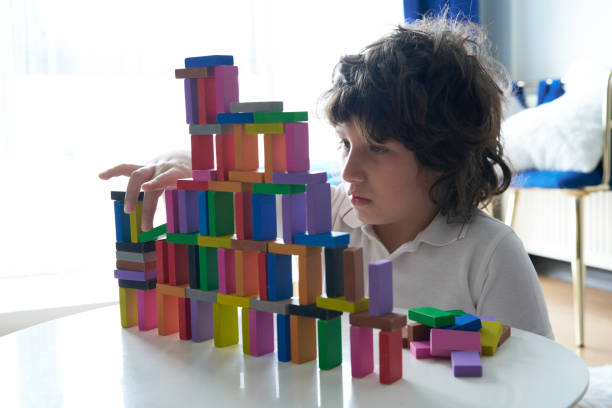 istock Cute Little Boy Playing with wooden block 1673127755