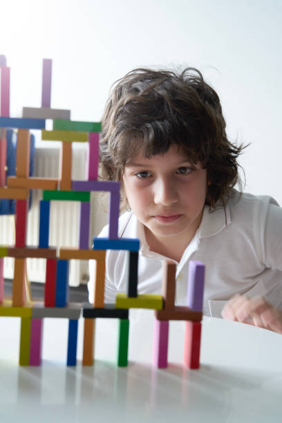 istock Cute Little Boy Playing with wooden block 1673129882