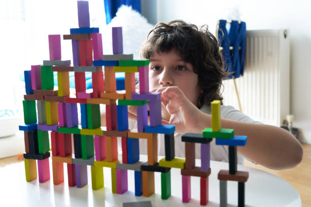 istock Cute Little Boy Playing with wooden block 1673130911