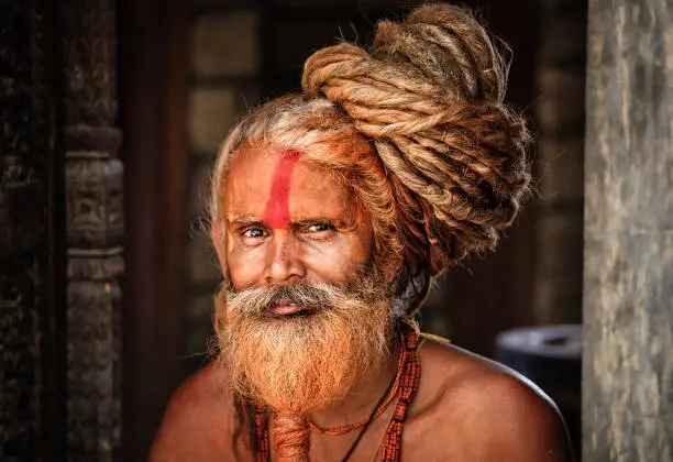 Holy man - Sadhu with very long dreads in temple. 