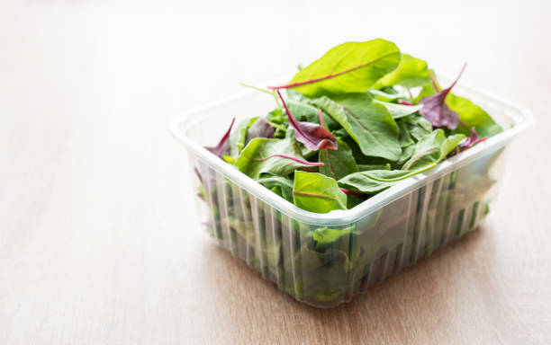 istock Salad mix in a box.  Fresh mixed salad leaves in plastic container 1673188892