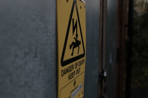 A closeup of a warning sign of danger