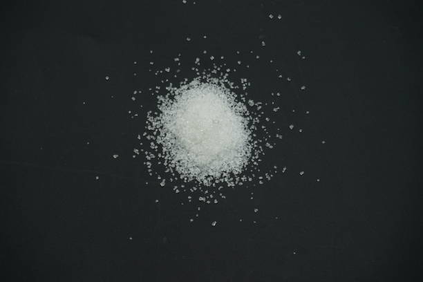 istock Sugar on black background , minimal sugar concept 1673213600