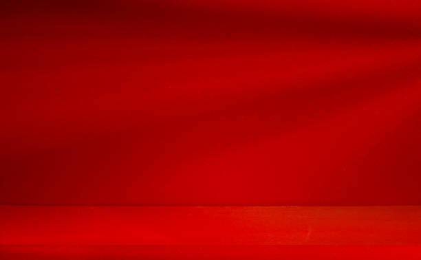 istock Backdrops and backgrounds inside a blank studio The counter displays products on a gray white background with shadow and red bottom with shadow. Modern luxury product display shelves 1673215711