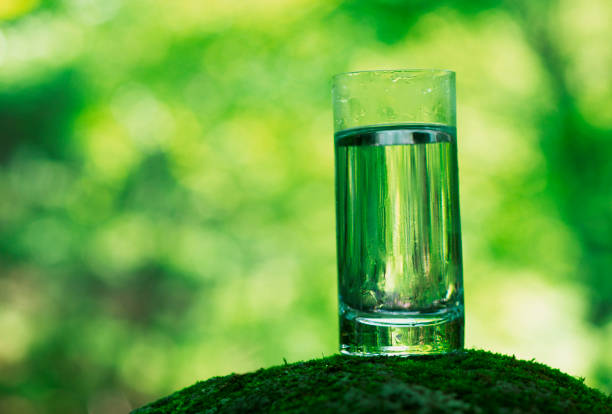 man holding glass of drinking water