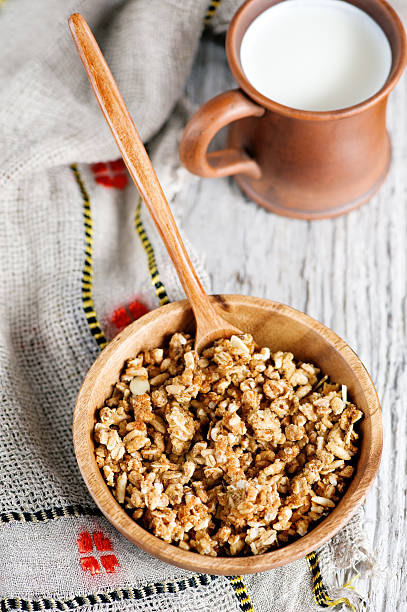 istock Muesli in wooden plate and milk 167326484