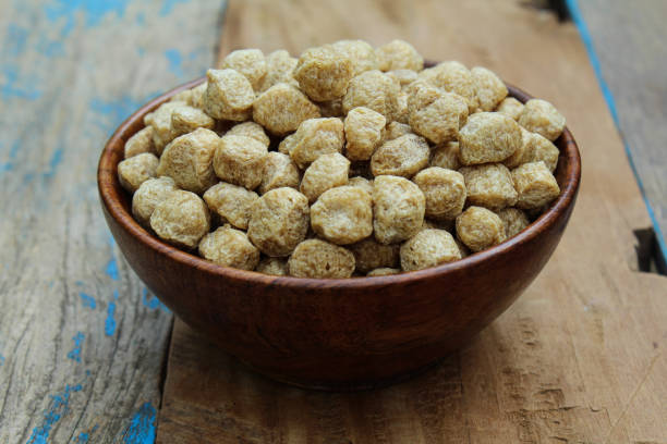 istock Soya mini chunks in a wooden bowl close-up view 1673268873