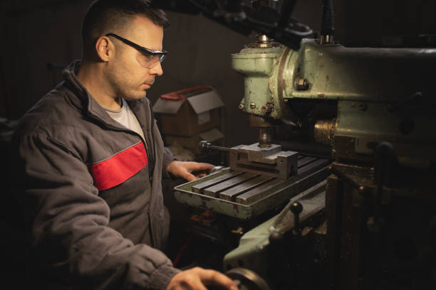 istock Young man is working on a metalcutting machine 1673307722