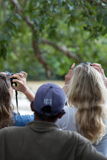 istock Two women with guide scan for wildlife 167331991