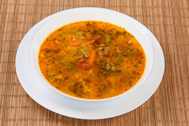 istock Vegetable red soup in bowl on the bamboo place mat 1673332987