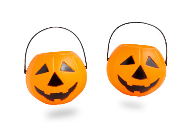 istock Floating Halloween Jack o Lantern pumpkin bucket, plastic pumpkin isolated on white background with clipping path. Scary halloween's 1673357785