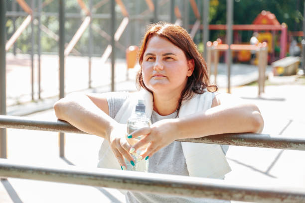 istock Rejuvenation After Exercise American Overweight Woman's Break 1673363265