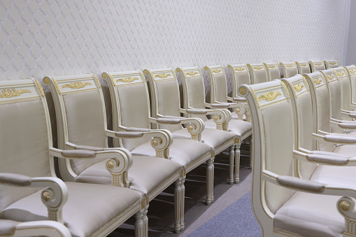Row of chairs in a row in the conference room, stock photo