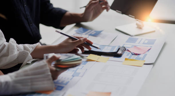istock Group of  business hands with business financial documents. 1673368086