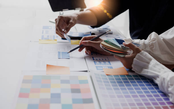 istock Group of  business hands with business financial documents. 1673368095