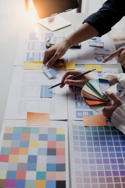 istock Group of  business hands with business financial documents. 1673368605