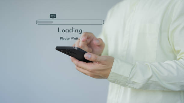 istock Young man using a mobile phone for download and update application and waiting to loading digital file data form the apps, very slow internet form wifi. Concept of waiting for load of loading symbol. 1673398734